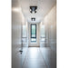 Modern closet with glossy white cabinets, wood-look flooring, and black ceiling-mounted spotlights.