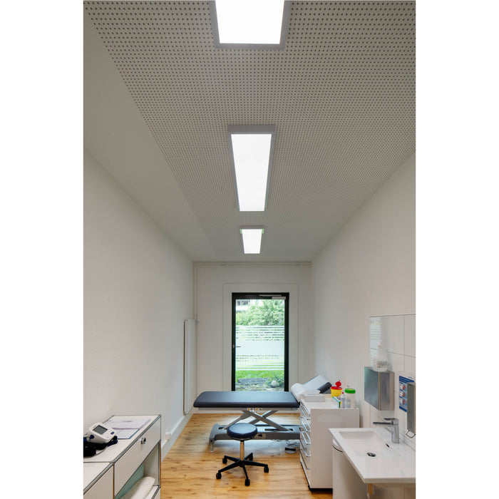 Recessed white LED panel lights in a perforated ceiling in a medical exam room.