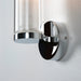 Clear glass and polished chrome wall sconce.