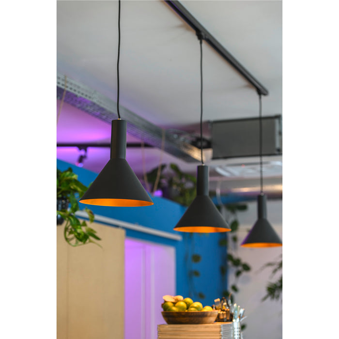 Three black metal pendant lights with gold interiors, track mounted.