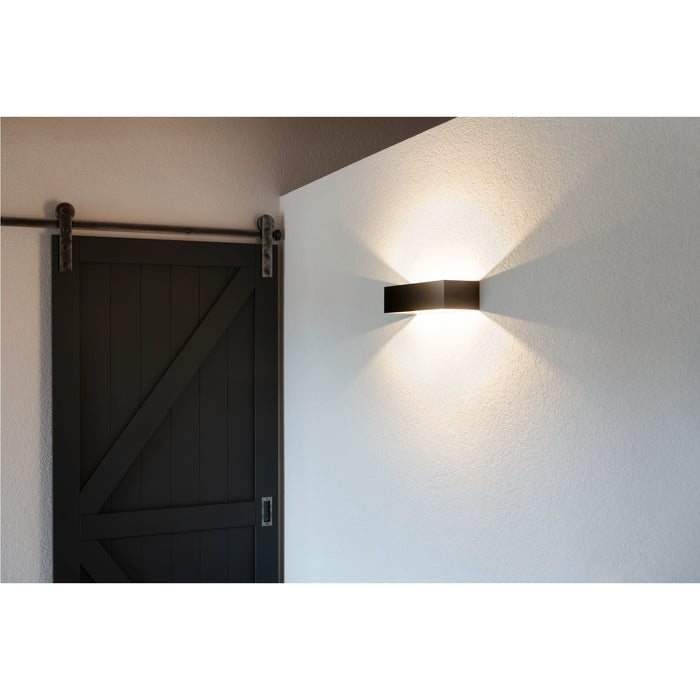Black metal wall sconce lighting fixture.