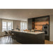 Modern kitchen with dark cabinets, marble countertop island, and open shelving.