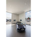 Blue Audi A3 Sportback car in a showroom with large windows.