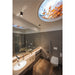 Modern bathroom with gray walls, brown tile floor, white sink, and ceiling light with autumn leaves.