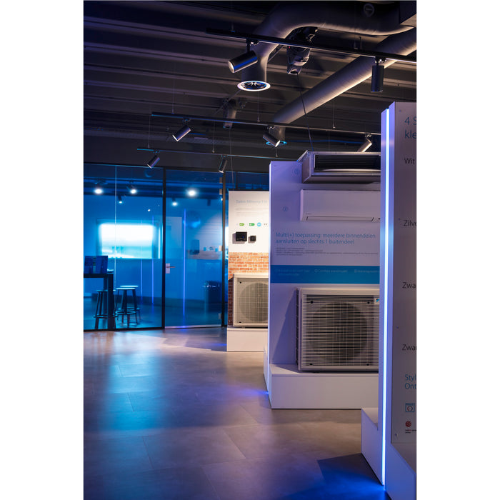 Showroom view of white Daikin Altherma air conditioning units on display.