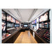 Inglot store interior with wood floor, black display cabinets, and makeup products.