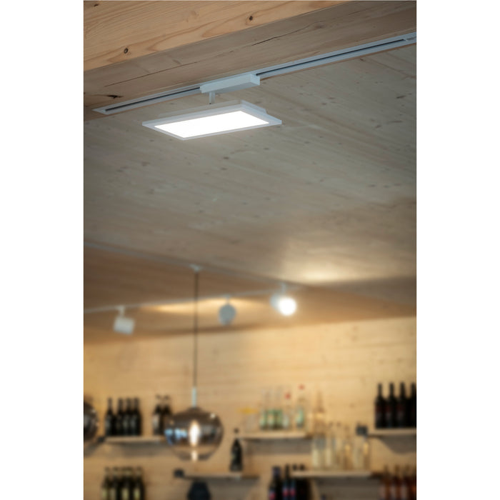 White rectangular LED panel light mounted on a track lighting system.