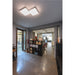 Modern office interior with gray walls, marble floor, black shelving, and a square white LED ceiling light.