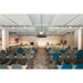 Auditorium with gray and blue upholstered chairs, gray carpet, and white ceiling panels.