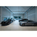 New car showroom with black and gray Volvo and Polestar vehicles.