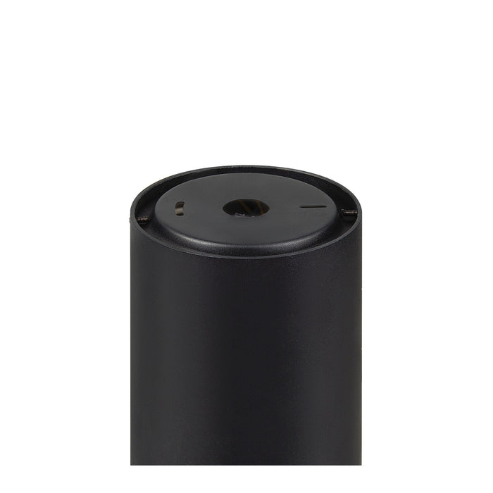 Close-up of a black, cylindrical, metal outdoor light fixture with a matte finish.