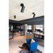 Modern office interior with black cylinder track lights, surface mounted on a textured ceiling.