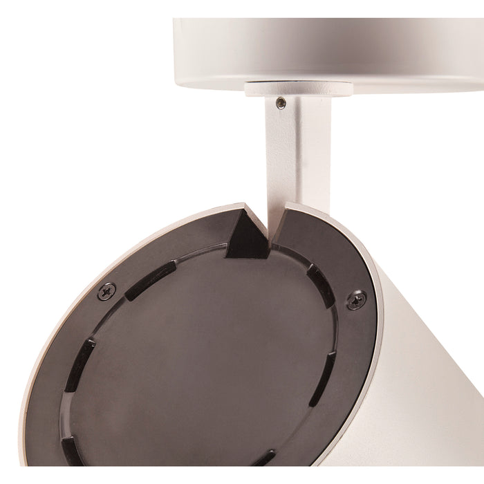 Close-up of a ceiling-mounted light fixture; metal, matte white finish, with a dark gray interior.