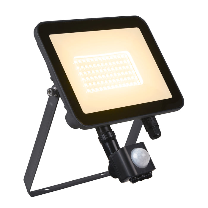 Black metal LED flood light with motion sensor, bracket mounted.