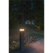 Dark gray bollard light fixture, ground mounted.