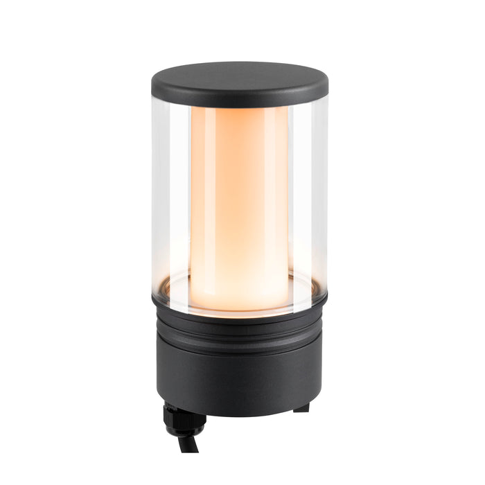 Black metal and clear glass outdoor path light with warm light.