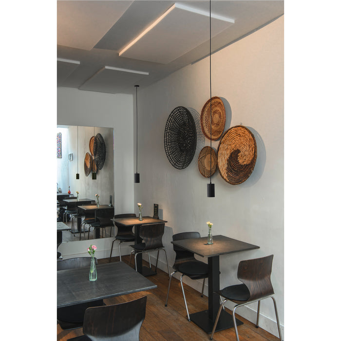 Black cylinder pendant light fixture, ceiling mounted.