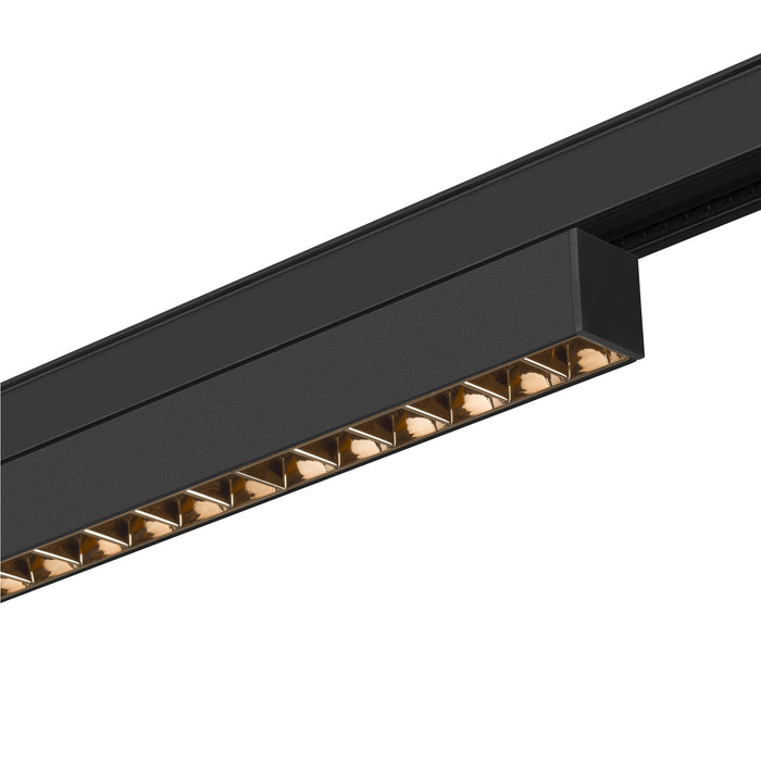 Black track lighting fixture, mounted, with textured finish.