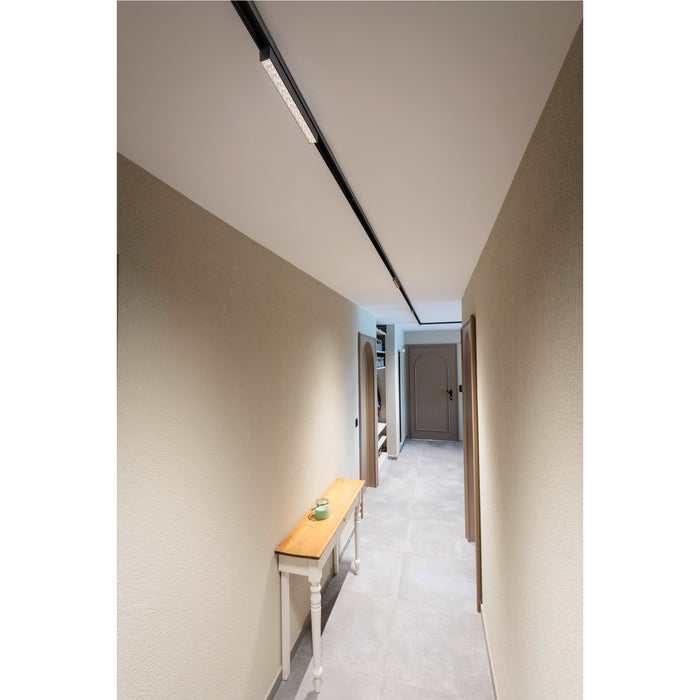 Black track lighting fixture, ceiling mounted.