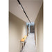Black track lighting fixture, ceiling mounted.
