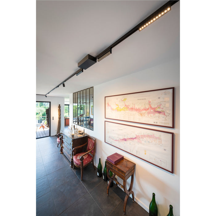 Modern interior with black track lighting fixture mounted on the ceiling.