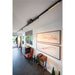 Modern interior with black track lighting fixture mounted on the ceiling.