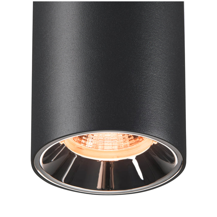 Black cylinder surface-mounted light fixture with textured finish and chrome reflector.