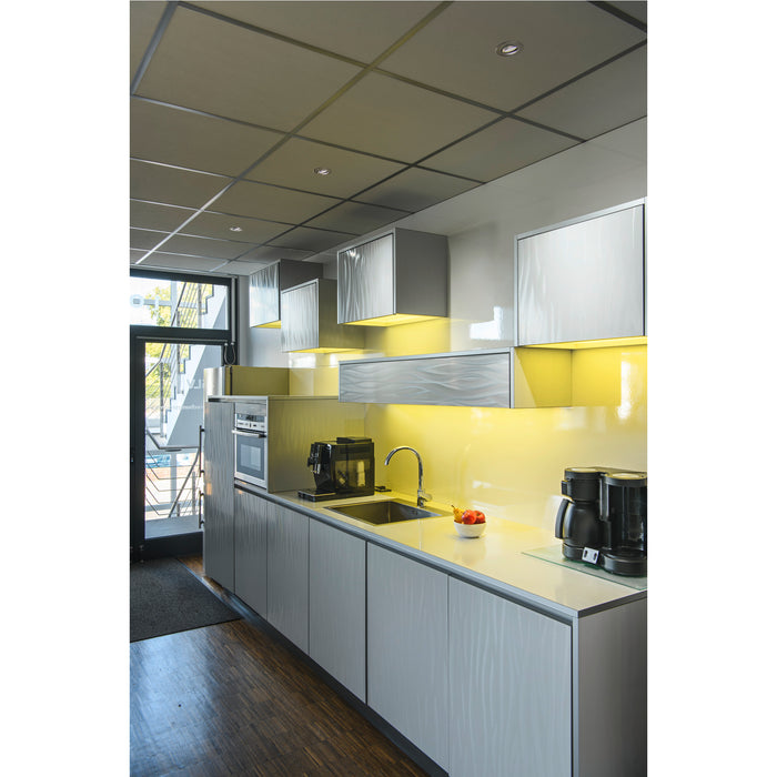 Modern kitchen with light gray cabinets, glossy finish, stainless steel appliances, and yellow backsplash.