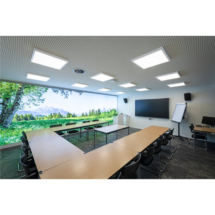 Conference room with wood tables, black chairs, large screen, and nature scene wall mural.