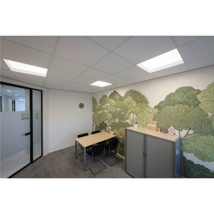 Office meeting room with wood table, black chairs, gray metal cabinet, and tree mural.