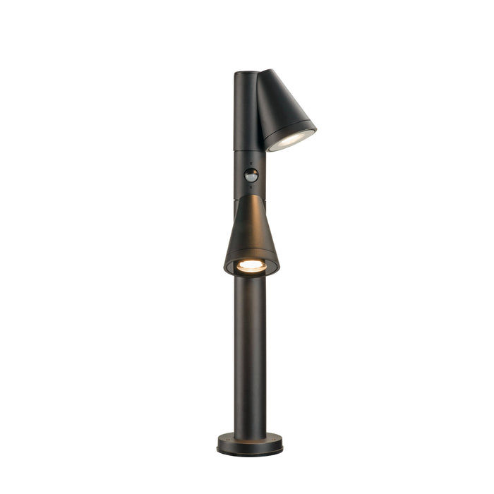 Black metal bollard light with two adjustable spotlights and a textured finish.