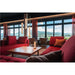 Modern ribbed glass pendant lights with bronze finish in a red-themed lounge.