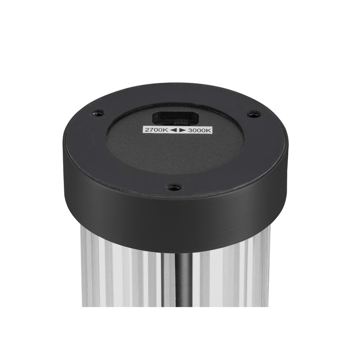 Close-up of a black metal light fixture with a color temperature switch (2700K-3000K).