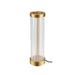 Table lamp with clear ribbed glass shade and gold finish metal base.