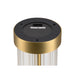 Close-up of a table lamp base showing the 2700K-3000K color temperature switch, gold finish, and fluted glass.