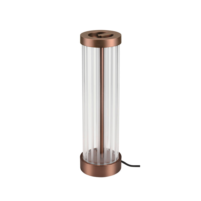 Table lamp with clear ribbed glass shade and copper finish metal base.