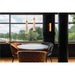 Modern ribbed glass pendant and wall sconce lighting in a dining area with round table and velvet chairs.