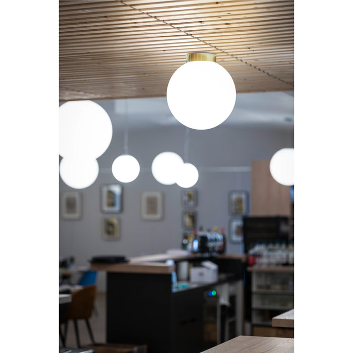 White glass globe ceiling light fixture with brass hardware.