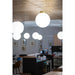 White glass globe ceiling light fixture with brass hardware.