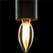 Hanging pendant light with a clear glass bulb and a textured black shade.