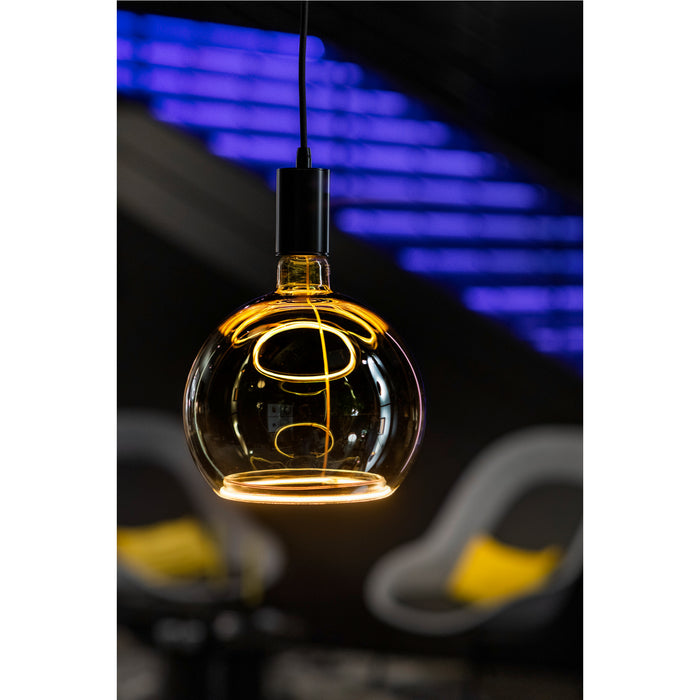 Hanging amber glass pendant light with black fixture.