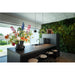 Modern kitchen island with dark marble countertop, black faucet, pendant lights, and stools.