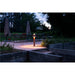 Bronze finish metal outdoor path light, ground mounted.