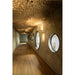 Hallway with wood floor, textured plaster walls, round windows, and wood slat ceiling.