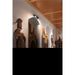Antique wood statues of kings with crowns, various finishes, displayed indoors.