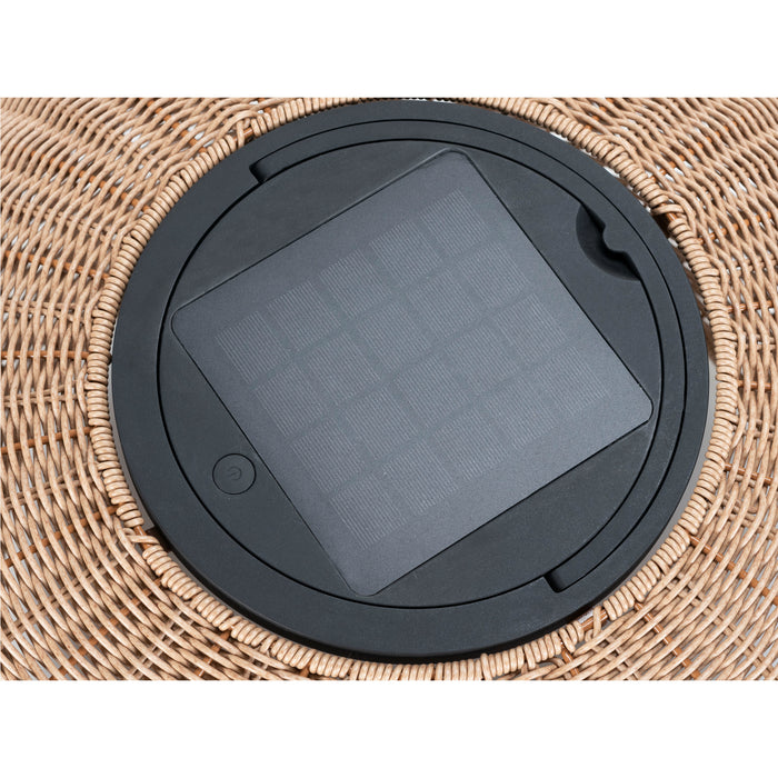 Close-up of a tan wicker basket with a black solar panel insert.