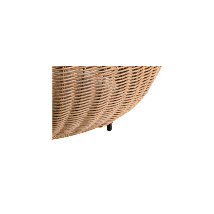 Close-up of a round, light brown wicker side table with black legs.