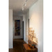 White track lighting fixture with three adjustable spotlights, ceiling mounted.