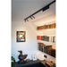 Black track lighting with bronze spotlights, ceiling mounted.