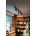 Black metal track lighting fixture with four adjustable spotlights, ceiling mounted.